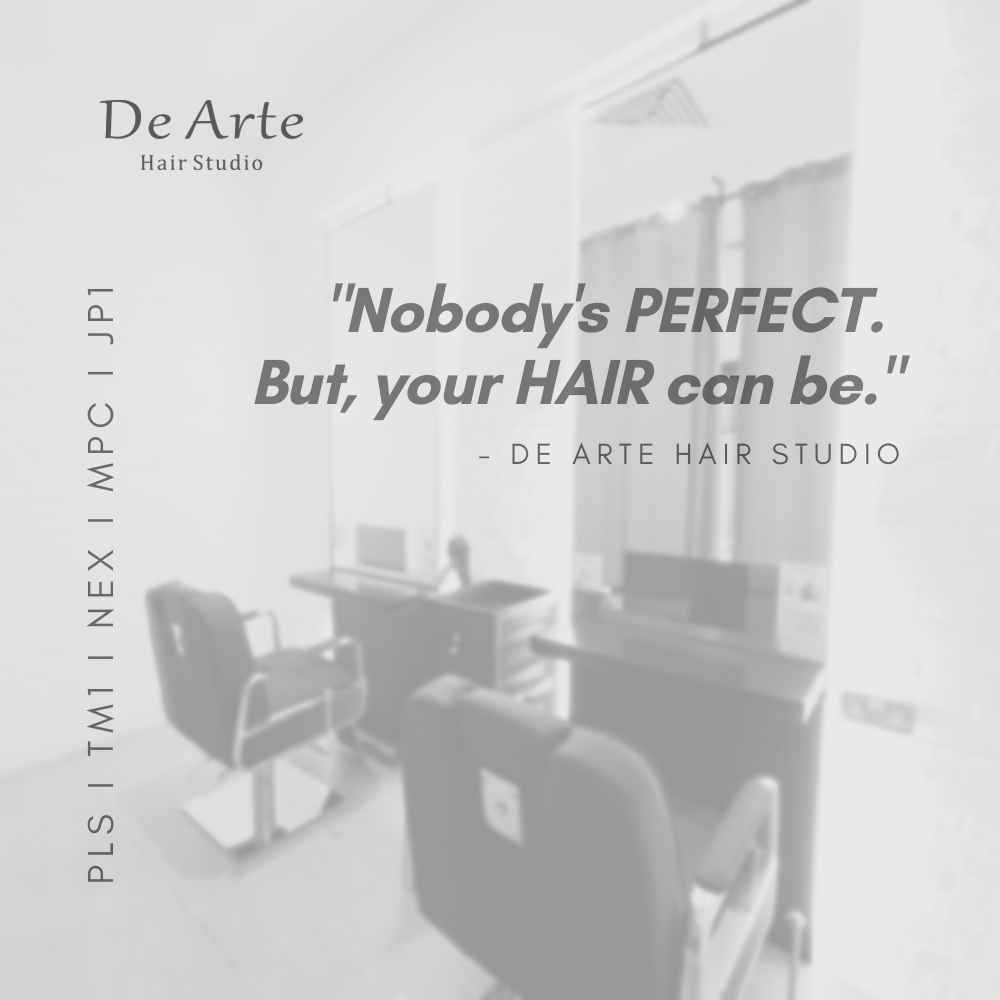 Chairs and large mirrors at De Arte Hair Studio with quote "Nobody's perfect. But, your Hair can be."